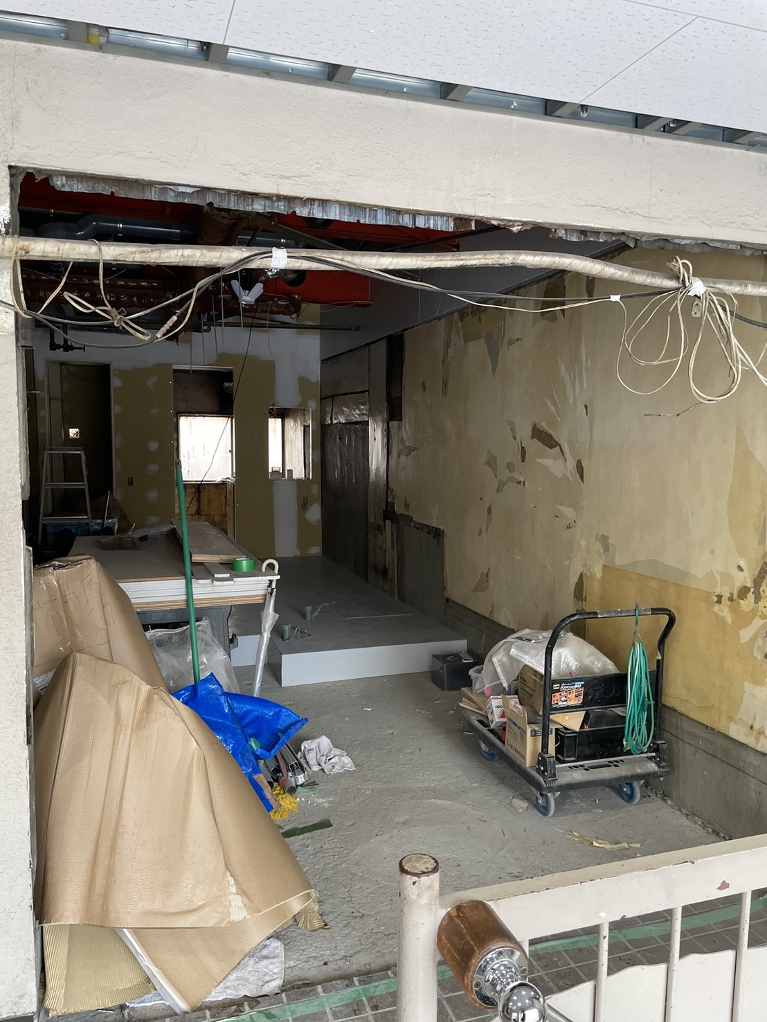 Gutted interior stripped to concrete with exposed wiring
